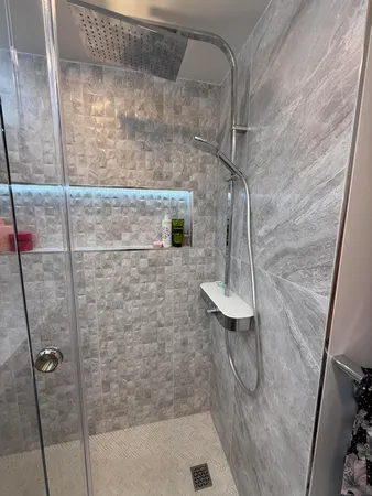 a bathroom with a sink a toilet and mirror