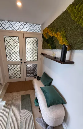 a work room with furniture and a window