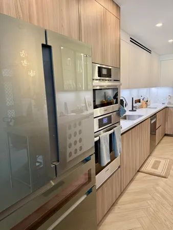 a kitchen with stainless steel appliances sink and cabinets