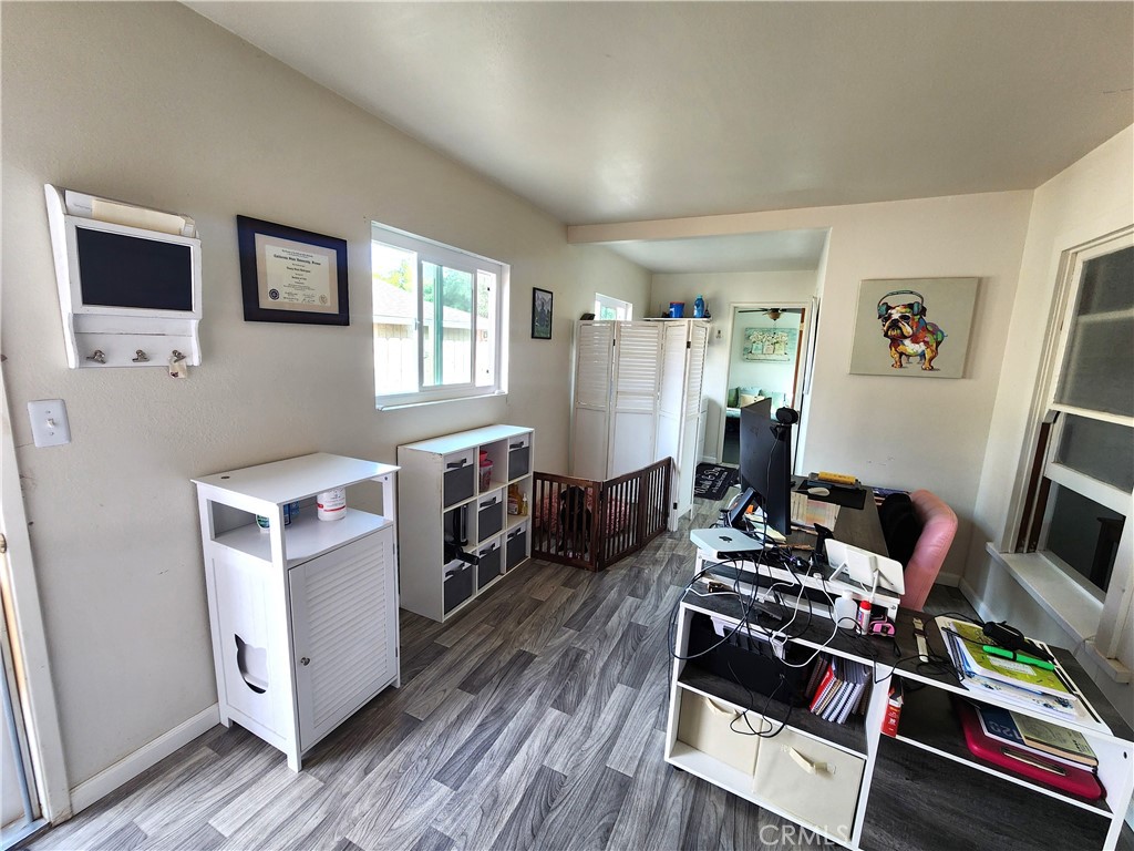 633 East Walnut Street Willows, CA 95988 - Photo 13 of 21 a living room with furniture and a flat screen tv