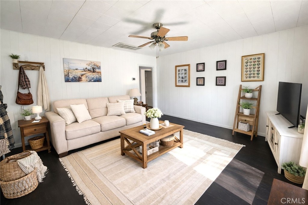 633 East Walnut Street Willows, CA 95988 - Photo 2 of 21 a living room with furniture and a flat screen tv