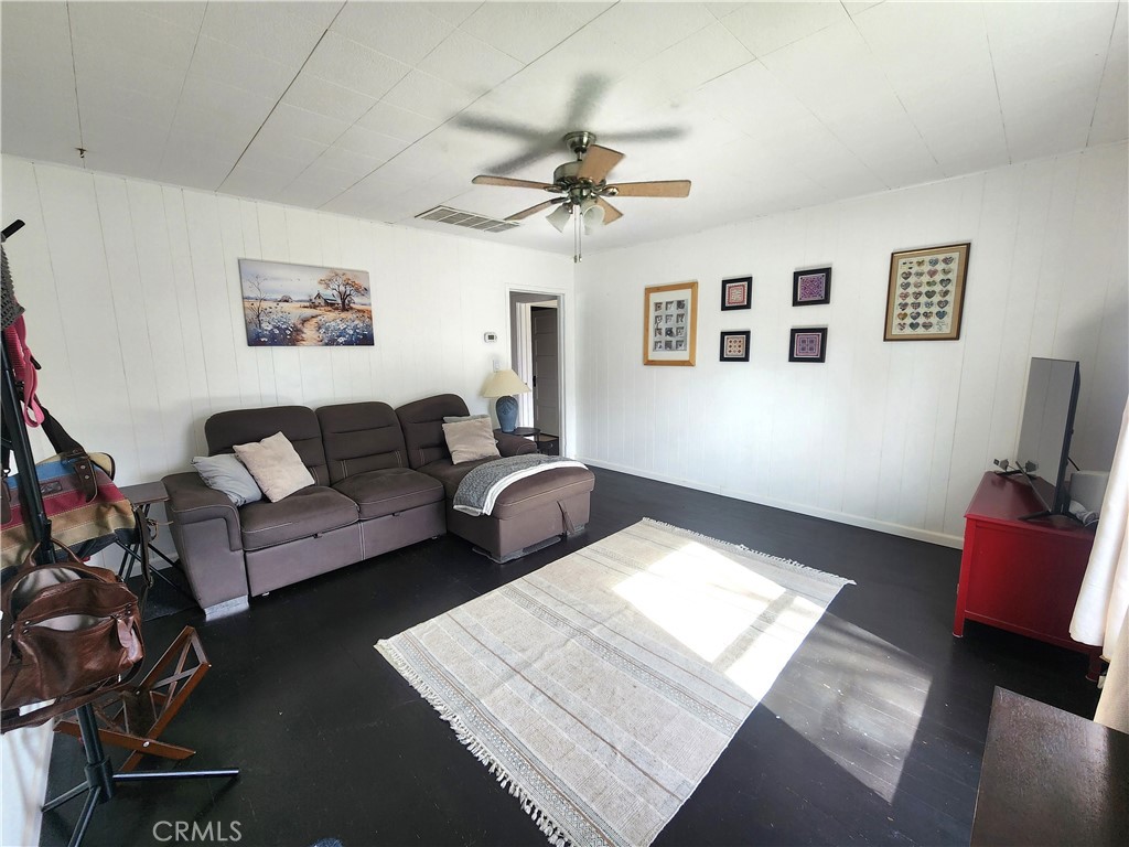 633 East Walnut Street Willows, CA 95988 - Photo 3 of 21 a living room with furniture and a rug