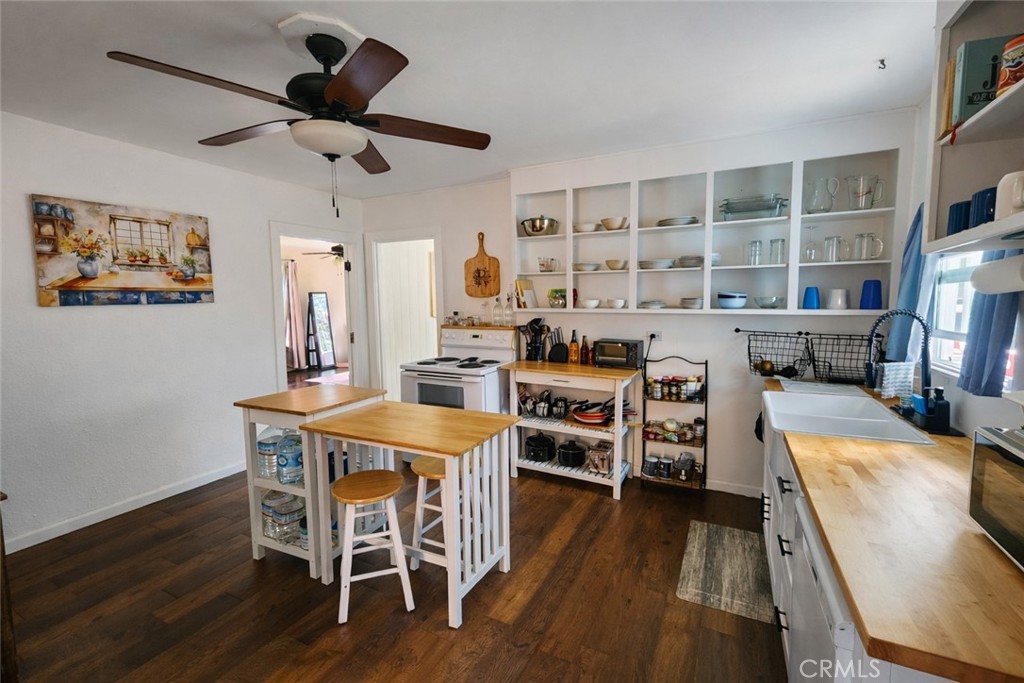 633 East Walnut Street Willows, CA 95988 - Photo 4 of 21 a view of a dining room with furniture window and wooden floor