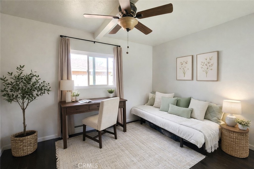 633 East Walnut Street Willows, CA 95988 - Photo 9 of 21 a living room with furniture and a potted plant