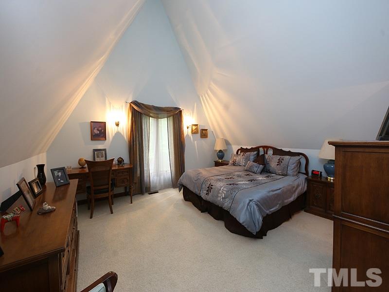 8600 Valley Brook Drive Raleigh, NC 27613 - Photo 11 of 25 a bedroom with bed and window