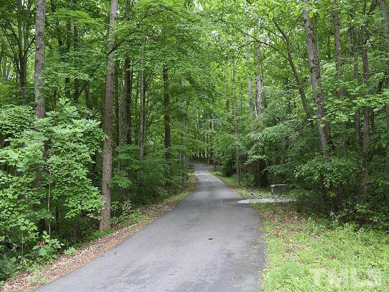 8600 Valley Brook Drive Raleigh, NC 27613 - Photo 20 of 25 a view of a forest with trees