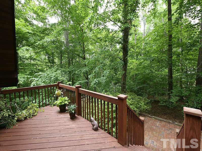 8600 Valley Brook Drive Raleigh, NC 27613 - Photo 23 of 25 a view of balcony with deck and trees