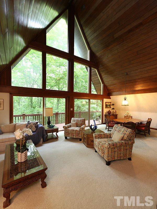 8600 Valley Brook Drive Raleigh, NC 27613 - Photo 4 of 25 a living room with furniture and a large window