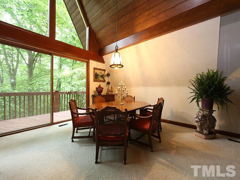 8600 Valley Brook Drive Raleigh, NC 27613 - Photo 5 of 25 a view of a dining room with furniture window and outside view