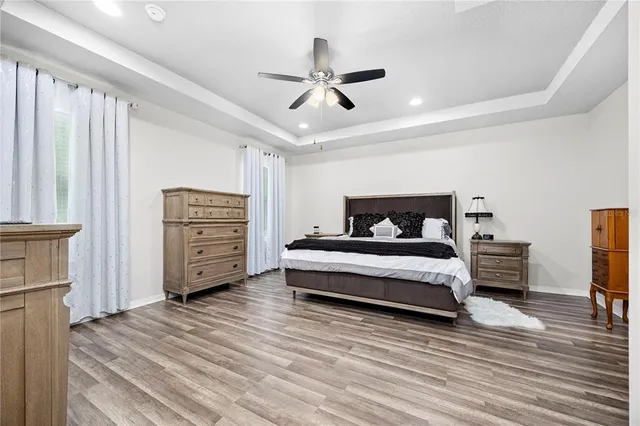 a bathroom with a sink a vanity and a large mirror