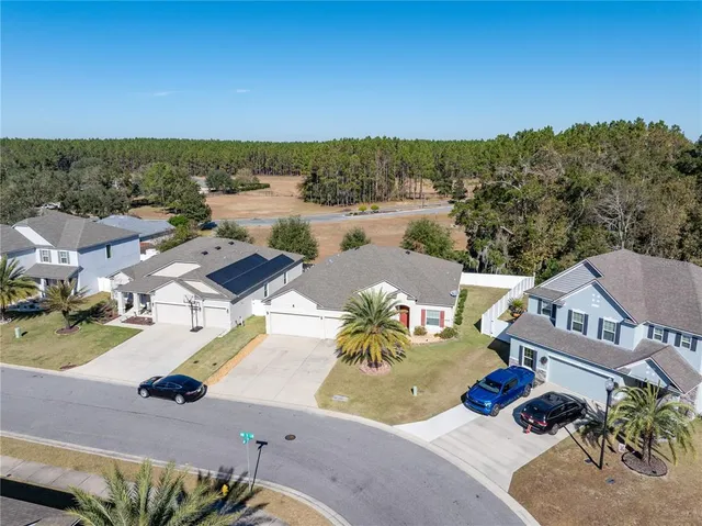 an aerial view of a house with outdoor space