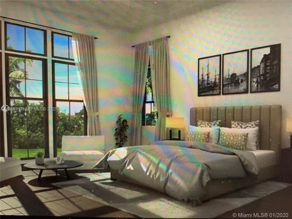 a bedroom with a large bed and a large window