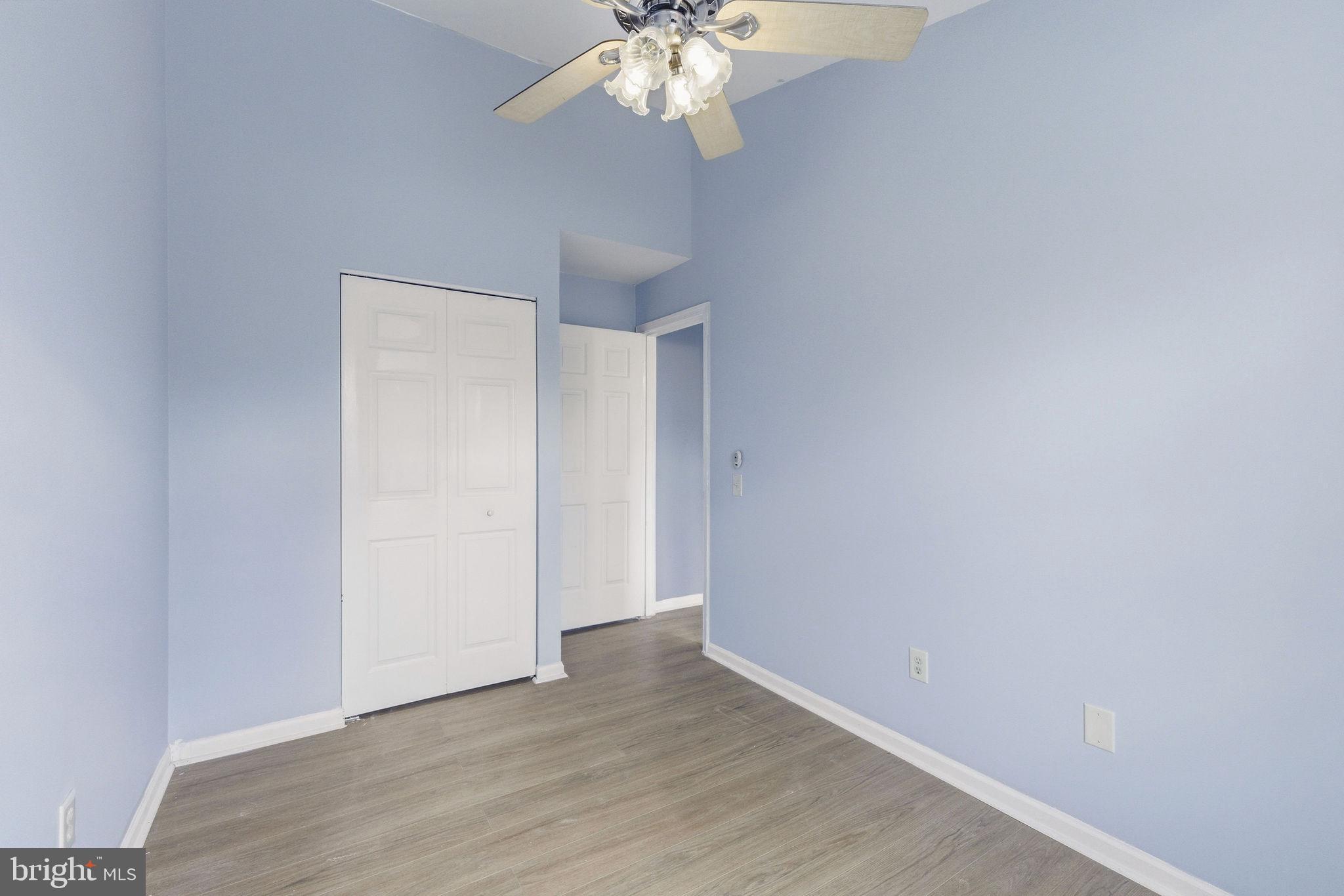 14688 Basingstoke Loop Centreville, VA 20120 - Photo 20 of 34 a view of an empty room with wooden floor