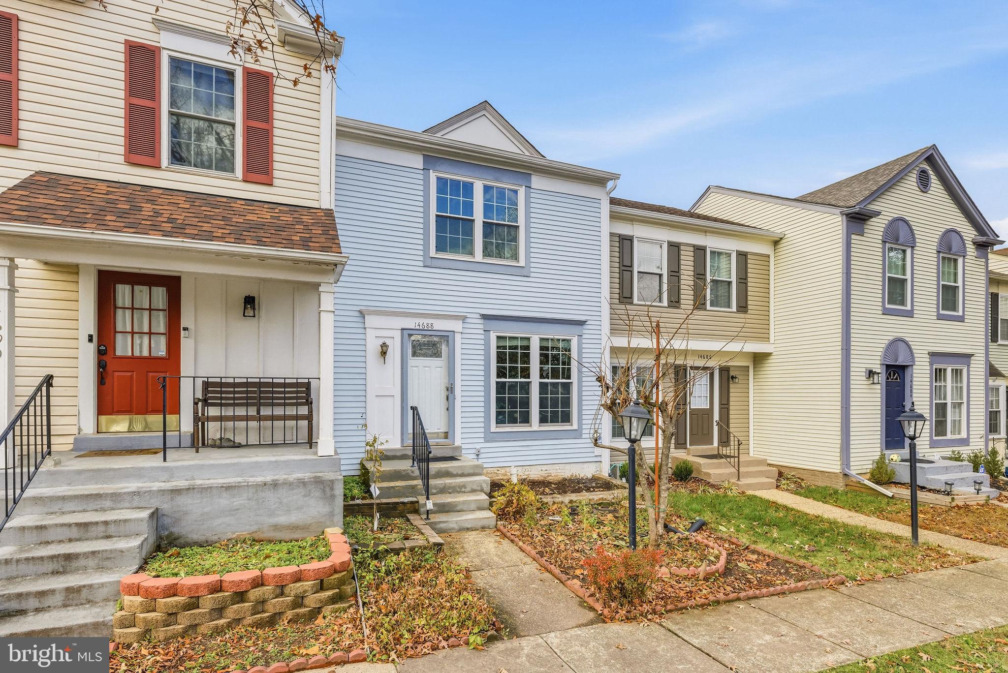 14688 Basingstoke Loop Centreville, VA 20120 - Photo 2 of 34 a front view of a house with a yard