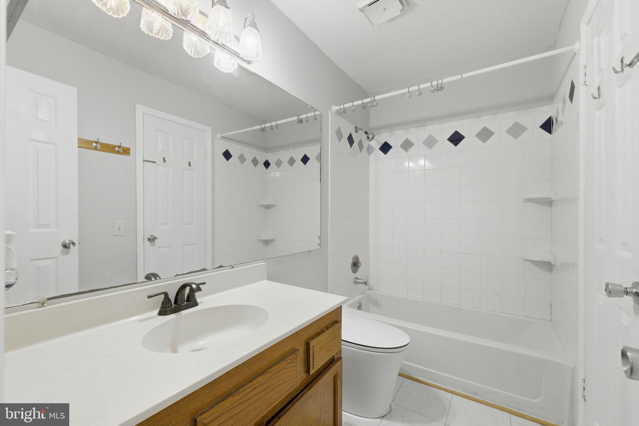 14688 Basingstoke Loop Centreville, VA 20120 - Photo 21 of 34 a bathroom with a sink a toilet and shower