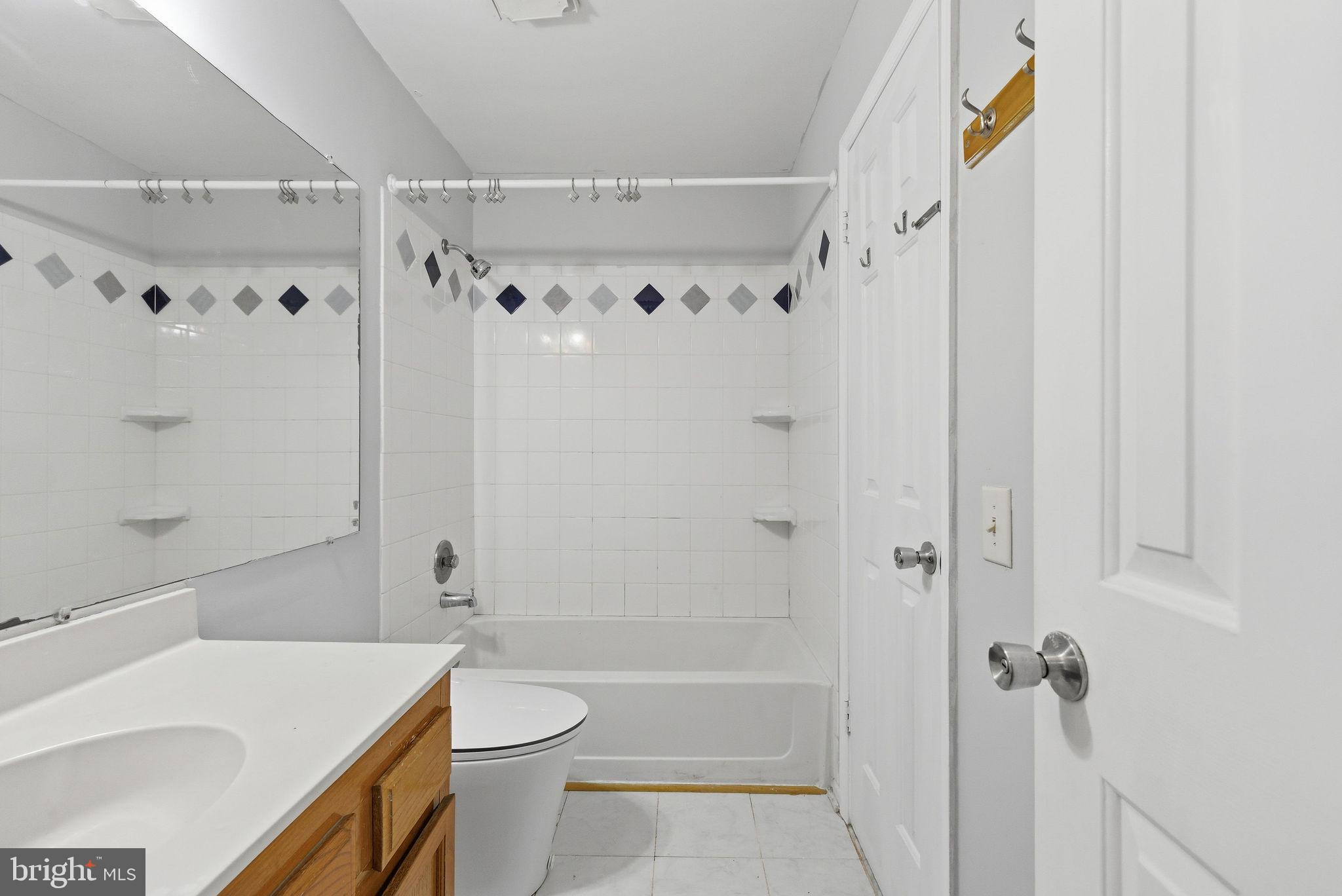 14688 Basingstoke Loop Centreville, VA 20120 - Photo 22 of 34 a bathroom with a sink a toilet and shower
