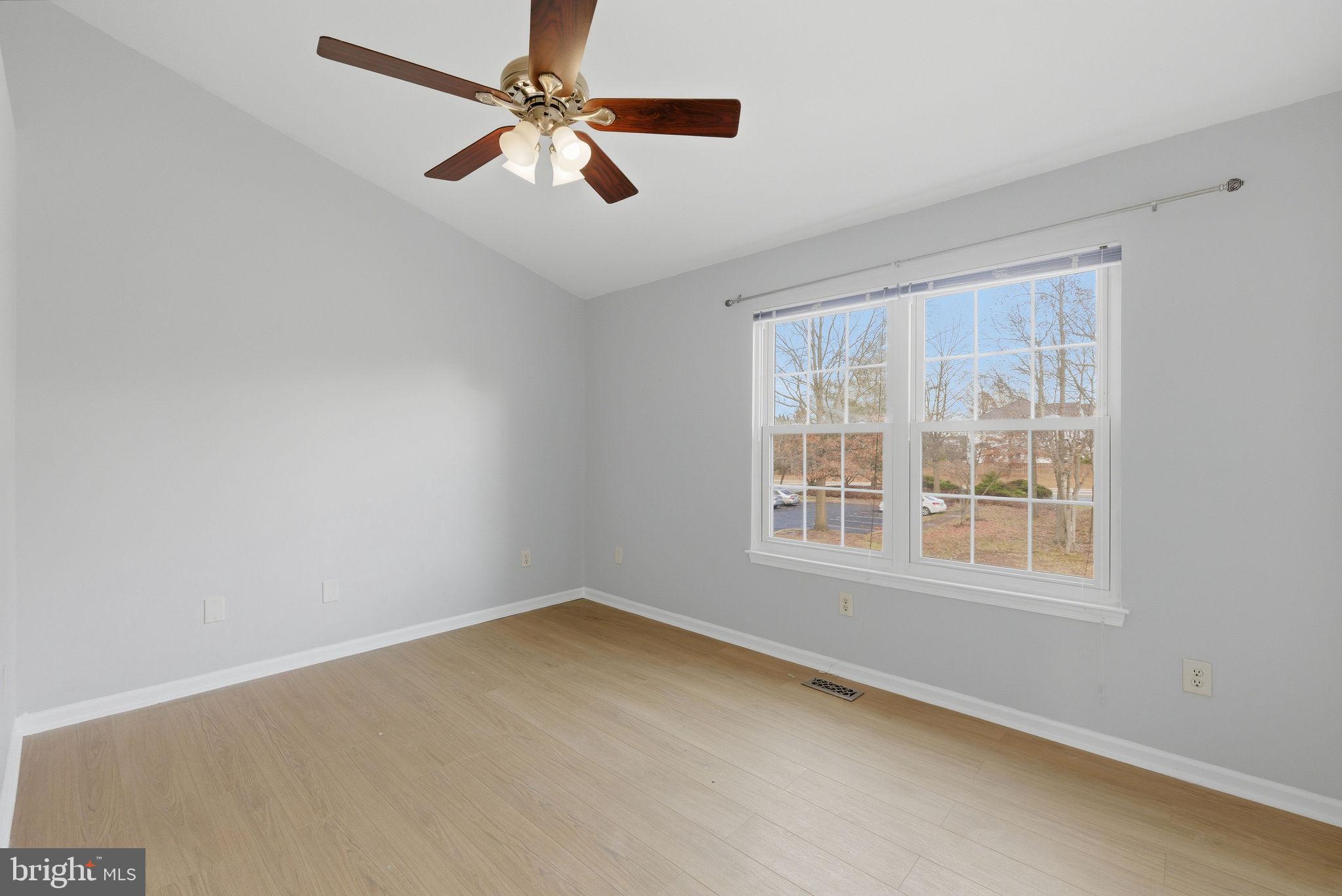 14688 Basingstoke Loop Centreville, VA 20120 - Photo 23 of 34 an empty room with a window and a fan