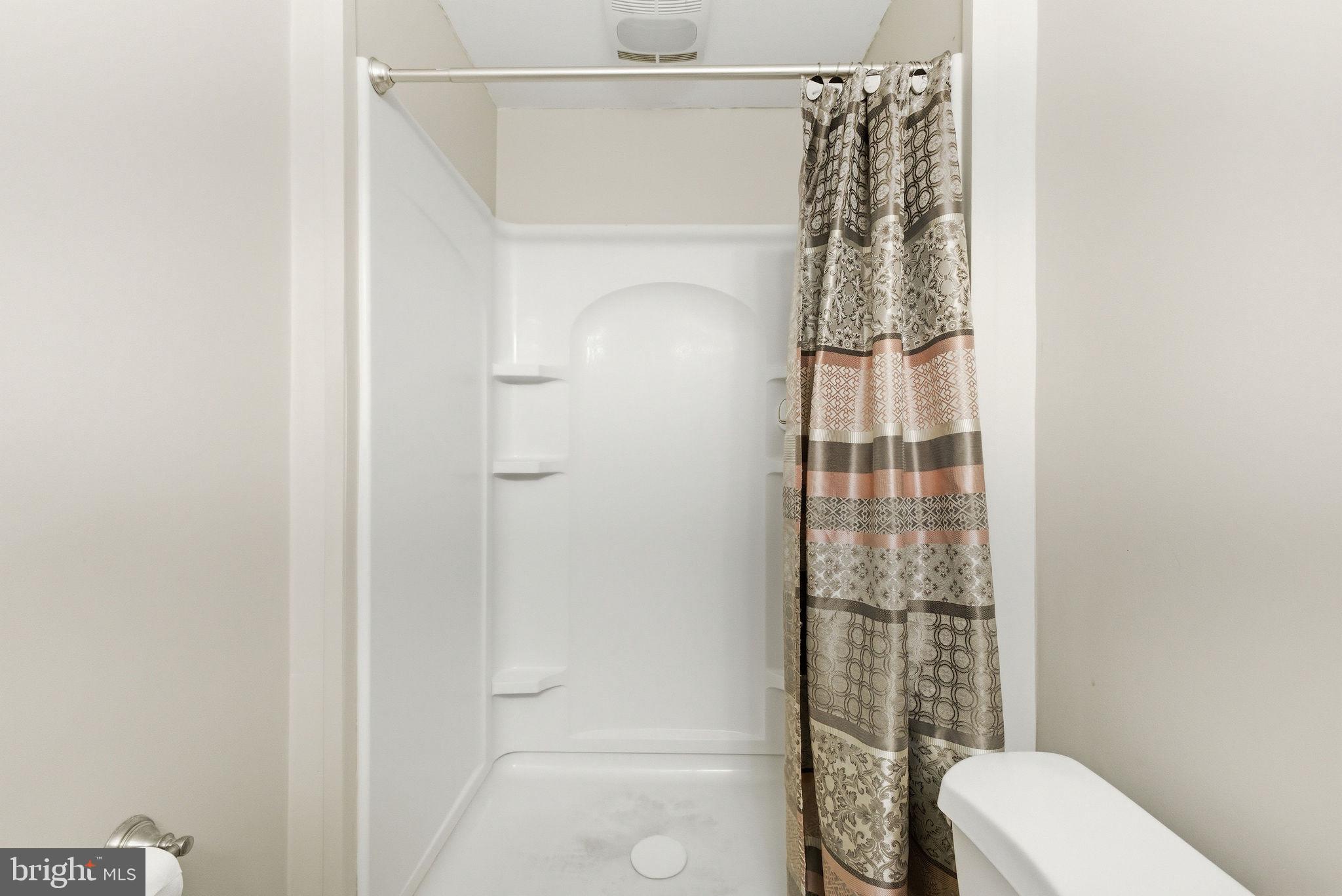 14688 Basingstoke Loop Centreville, VA 20120 - Photo 27 of 34 a bathroom with a shower a toilet and shower