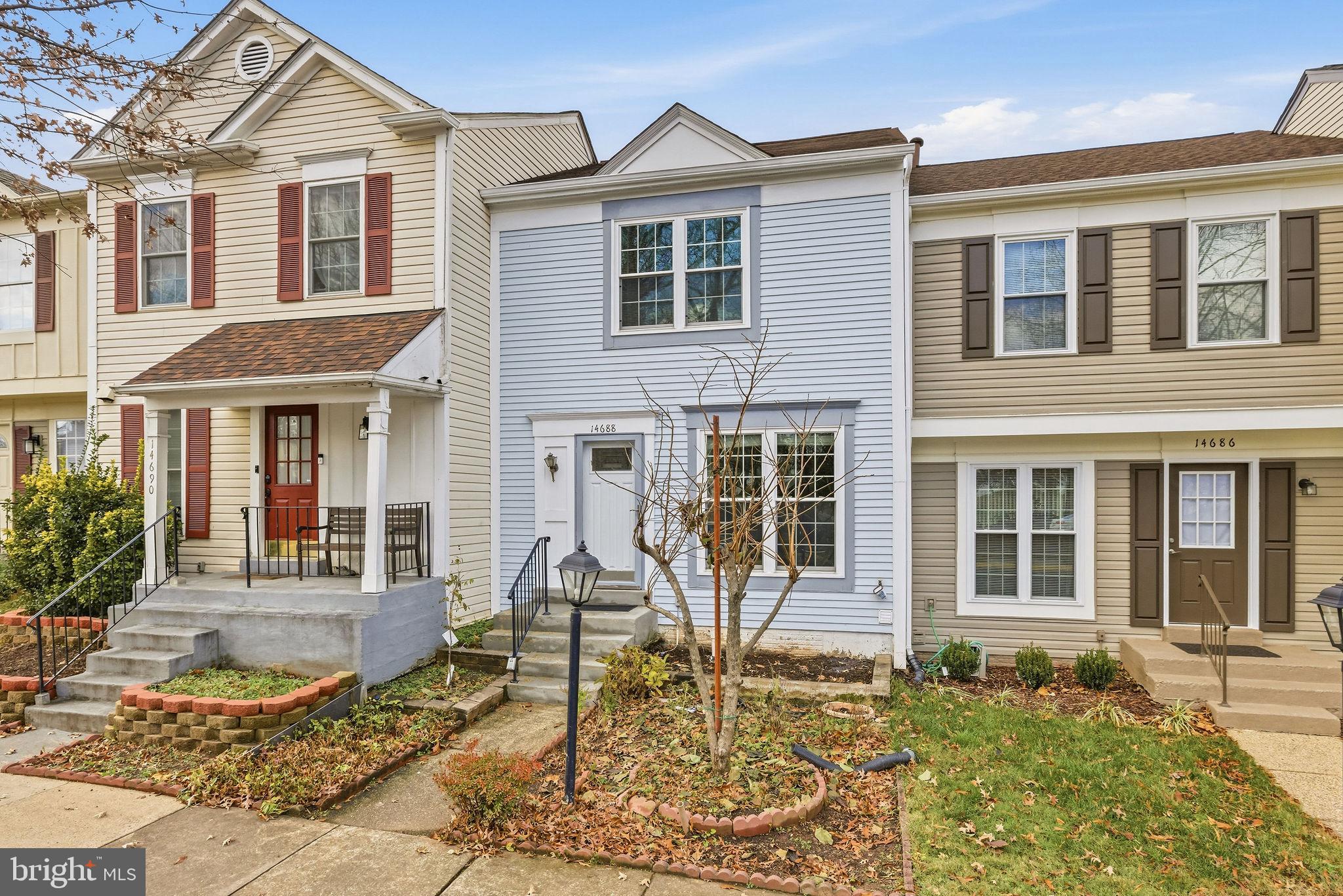 14688 Basingstoke Loop Centreville, VA 20120 - Photo 3 of 34 a front view of a house with a yard