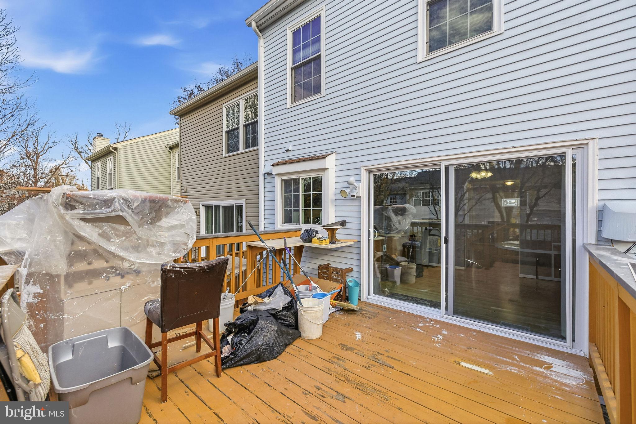 14688 Basingstoke Loop Centreville, VA 20120 - Photo 33 of 34 a view of a patio with table and chairs with wooden floor and fence