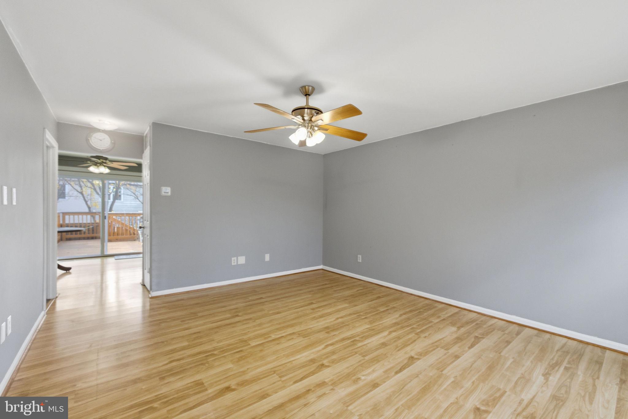 14688 Basingstoke Loop Centreville, VA 20120 - Photo 4 of 34 wooden floor in an empty room with a window