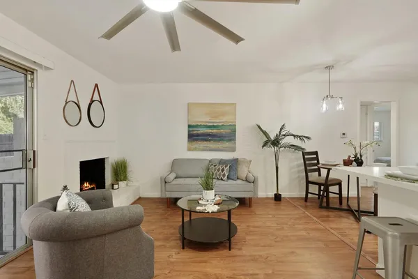 a living room with furniture and a fireplace