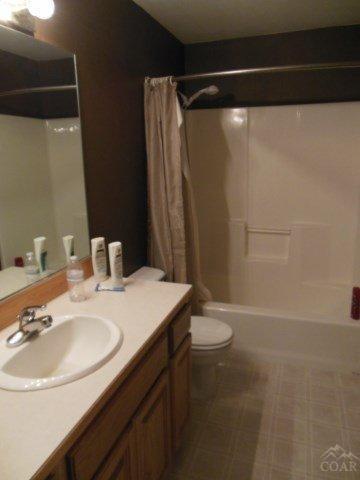 17246 Indio Road Bend, OR 97707 - Photo 14 of 21 a bathroom with a sink a toilet and a mirror