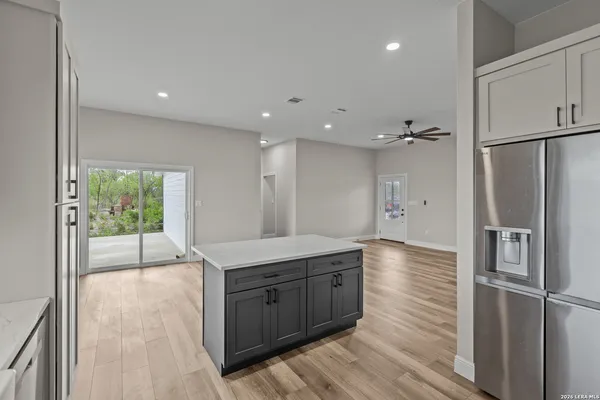 a kitchen with a refrigerator and countertop