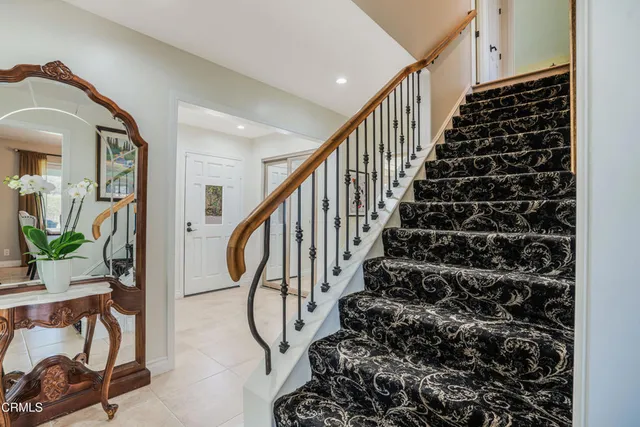 a bathroom with a double vanity sink a mirror and a bathtub