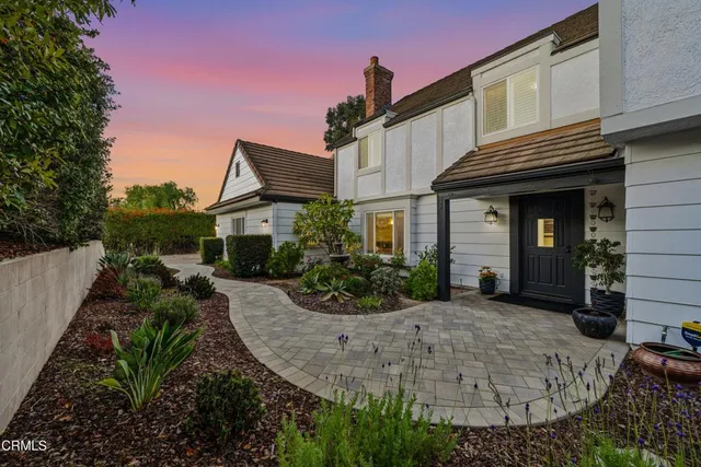 a swimming pool with outdoor seating and yard