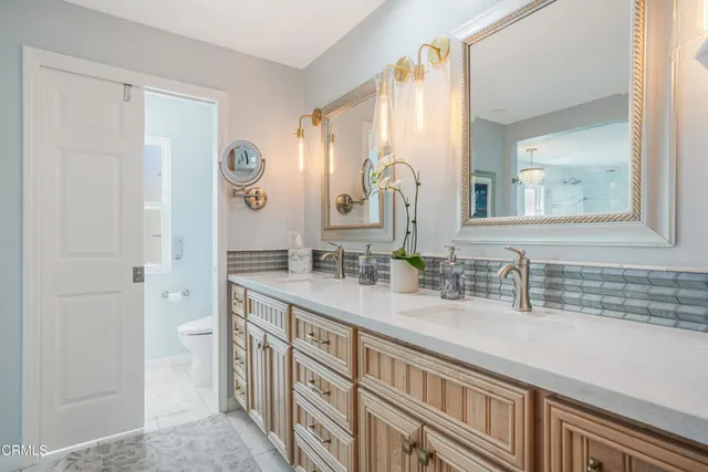 a view of a patio with a table chairs and a backyard