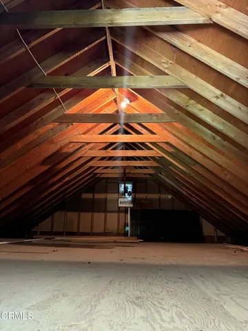 a view of a house with swimming pool and sitting area