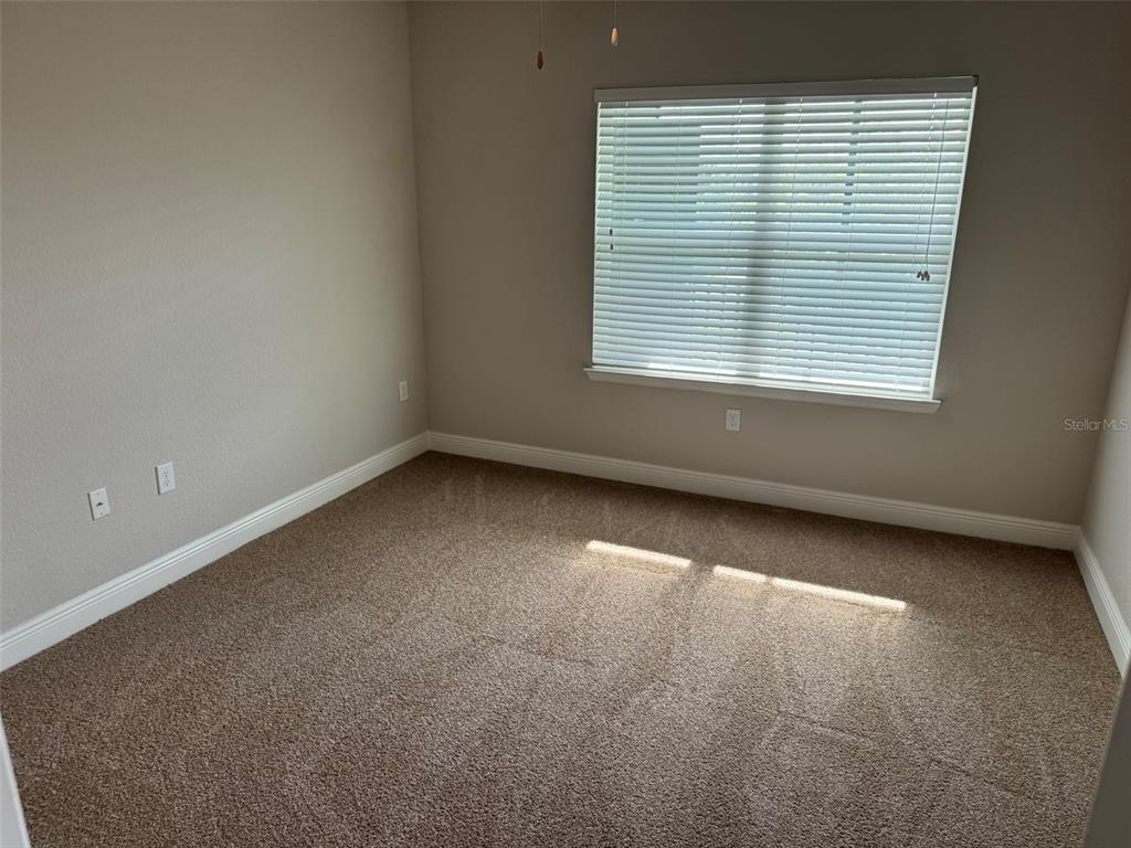 2420 Ann Rou Road, Unit 201 Tavares, FL 32778 - Photo 14 of 25 an empty room with a window