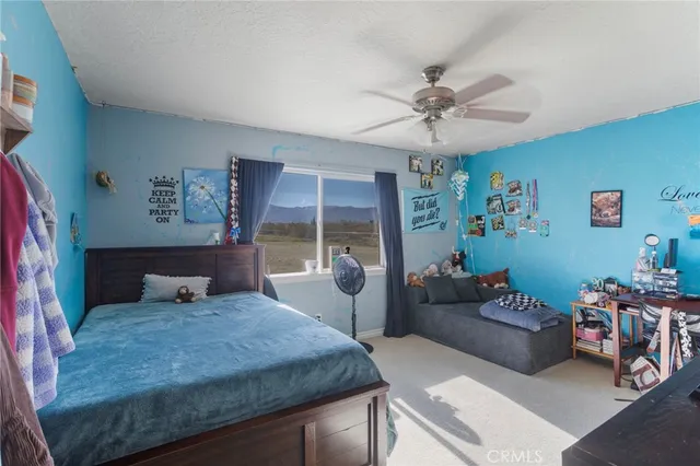 a bedroom with a bed and furniture