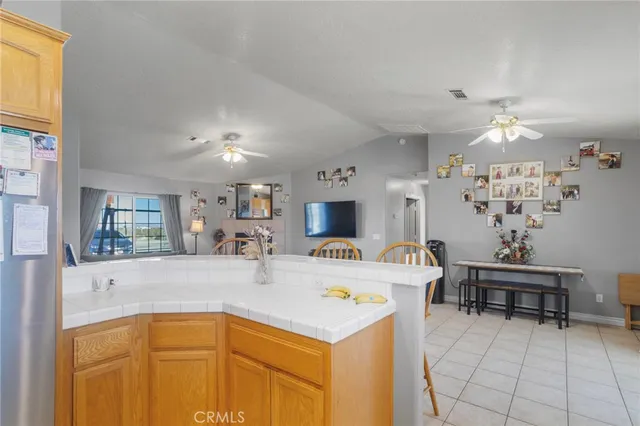 a view of a kitchen area with furniture and chandelier