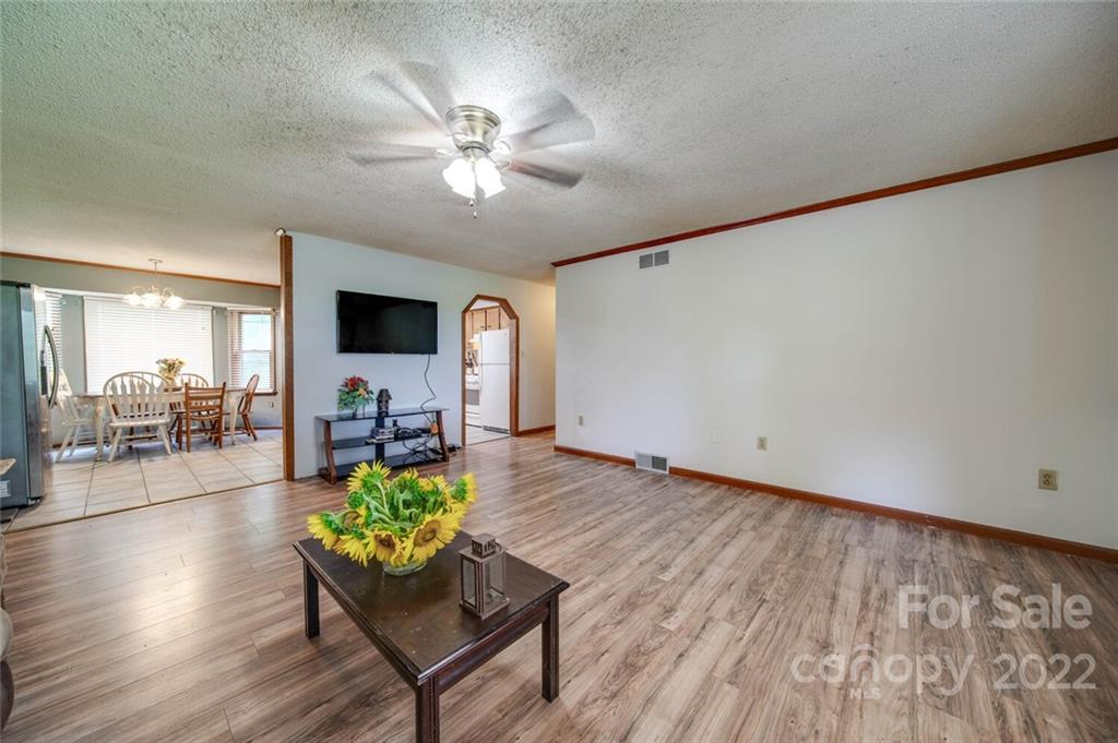 3210 Trinity Church Road Monroe, NC 28112 - Photo 12 of 29 a living room with furniture and a flat screen tv