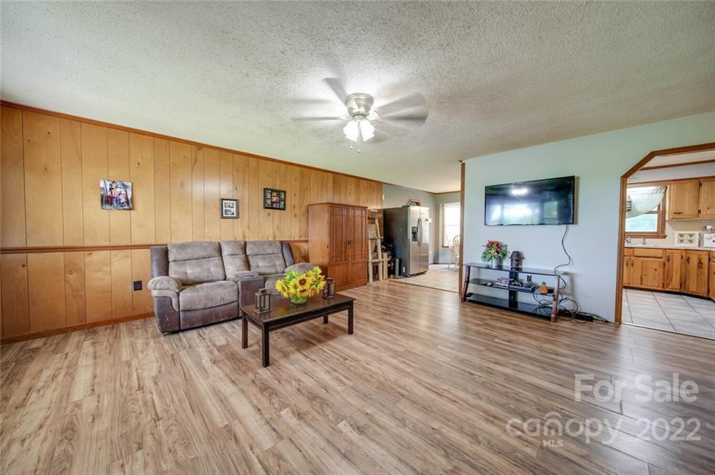 3210 Trinity Church Road Monroe, NC 28112 - Photo 13 of 29 a living room with furniture and wooden floor