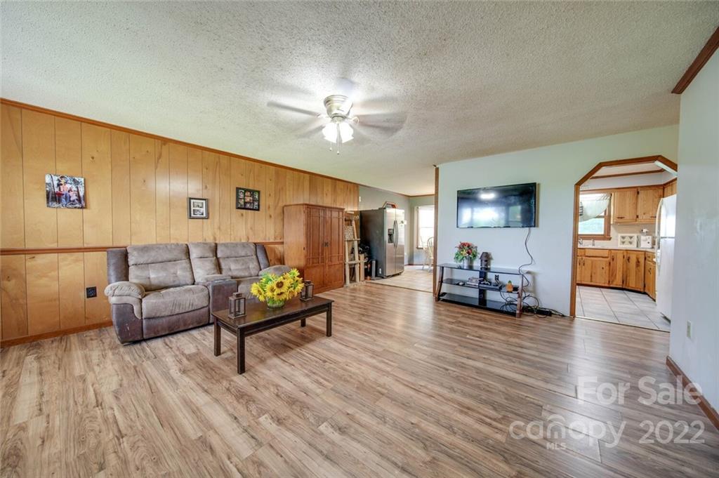 3210 Trinity Church Road Monroe, NC 28112 - Photo 14 of 29 a living room with furniture and wooden floor