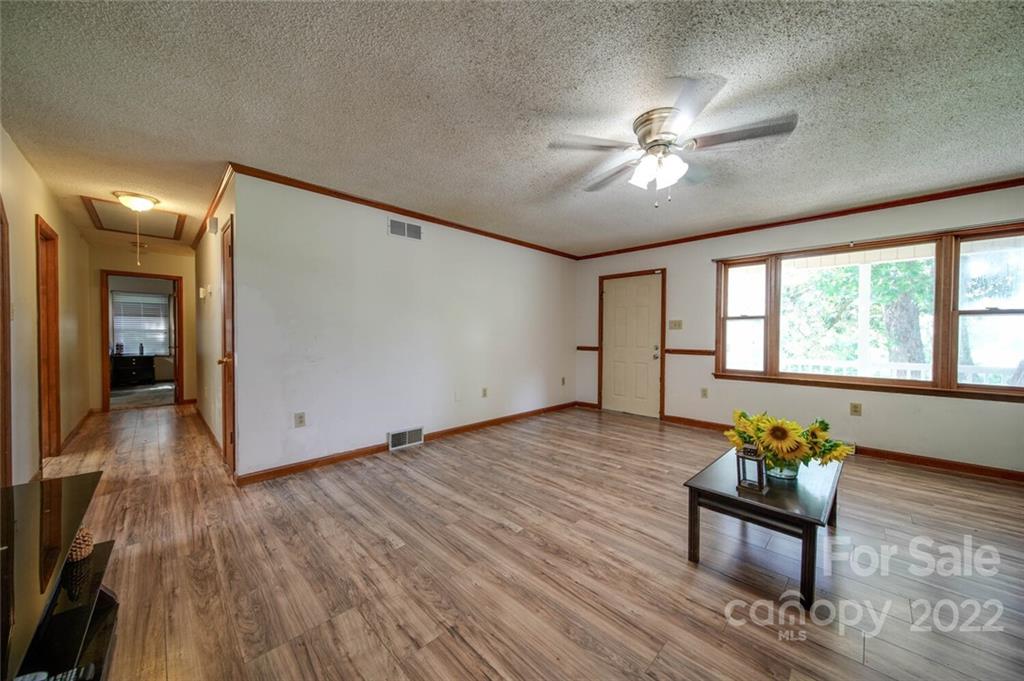 3210 Trinity Church Road Monroe, NC 28112 - Photo 16 of 29 a living room with furniture and a ceiling fan
