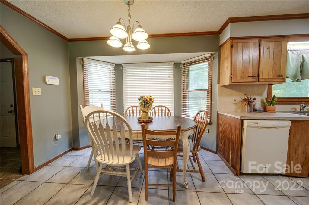 3210 Trinity Church Road Monroe, NC 28112 - Photo 20 of 29 a view of a dining room with furniture and chandelier