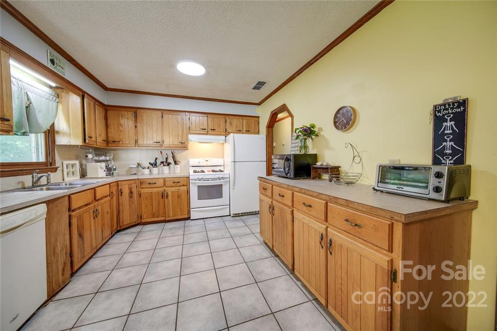 3210 Trinity Church Road Monroe, NC 28112 - Photo 22 of 29 a kitchen with a sink cabinets and window