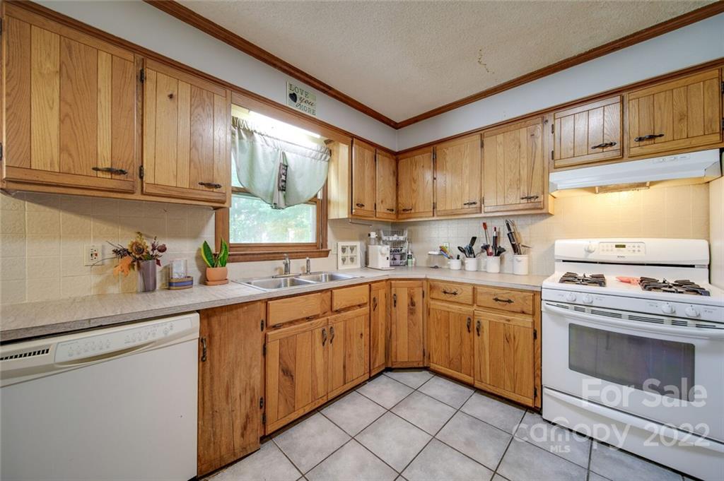 3210 Trinity Church Road Monroe, NC 28112 - Photo 24 of 29 a kitchen with granite countertop cabinets stainless steel appliances and a sink