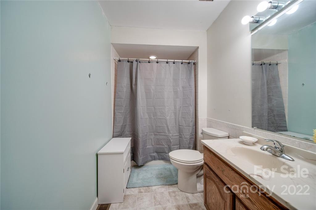 3210 Trinity Church Road Monroe, NC 28112 - Photo 26 of 29 a bathroom with a sink a toilet and shower