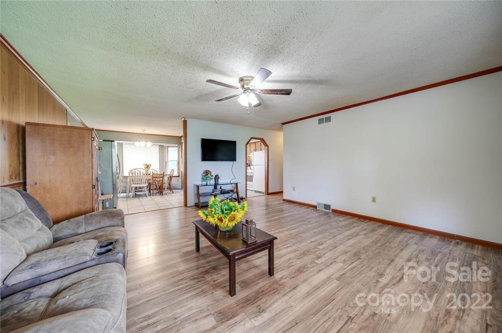 3210 Trinity Church Road Monroe, NC 28112 - Photo 29 of 29 a living room with furniture and wooden floor