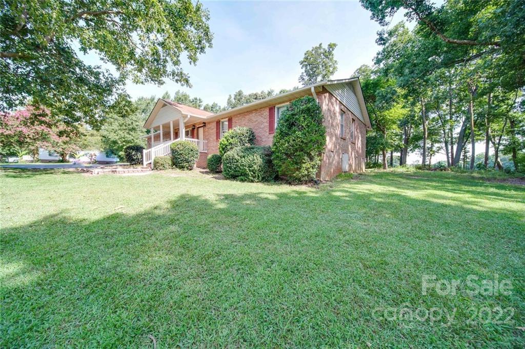 3210 Trinity Church Road Monroe, NC 28112 - Photo 6 of 29 a view of a house with a yard
