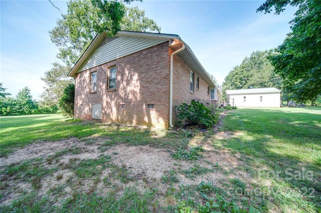 3210 Trinity Church Road Monroe, NC 28112 - Photo 7 of 29 a view of a house with backyard and garden
