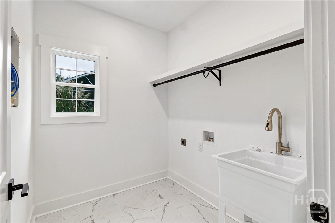 29 Hamilton Drive Bluffton, SC 29909 - Photo 14 of 33 Laundry room complete with wash basin.