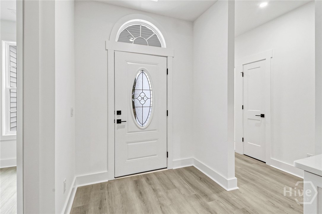 29 Hamilton Drive Bluffton, SC 29909 - Photo 17 of 33 Front Entry - bedrooms to the right and office to the left.