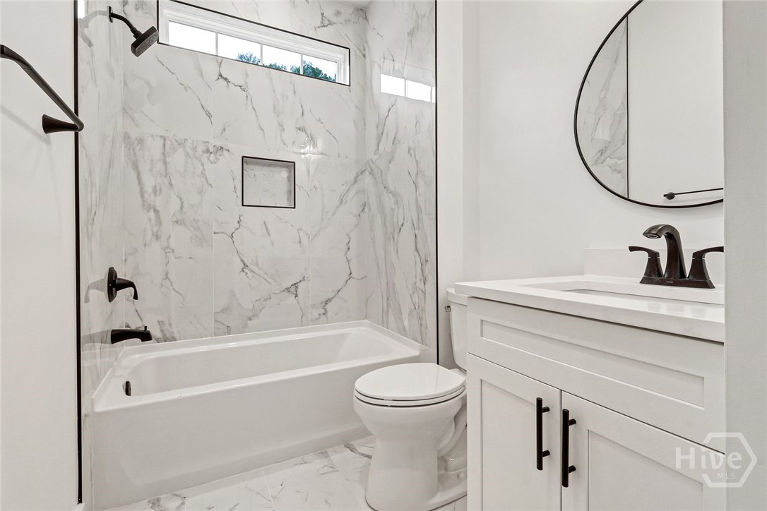 29 Hamilton Drive Bluffton, SC 29909 - Photo 29 of 33 Guest bathroom with tiled tub shower combo