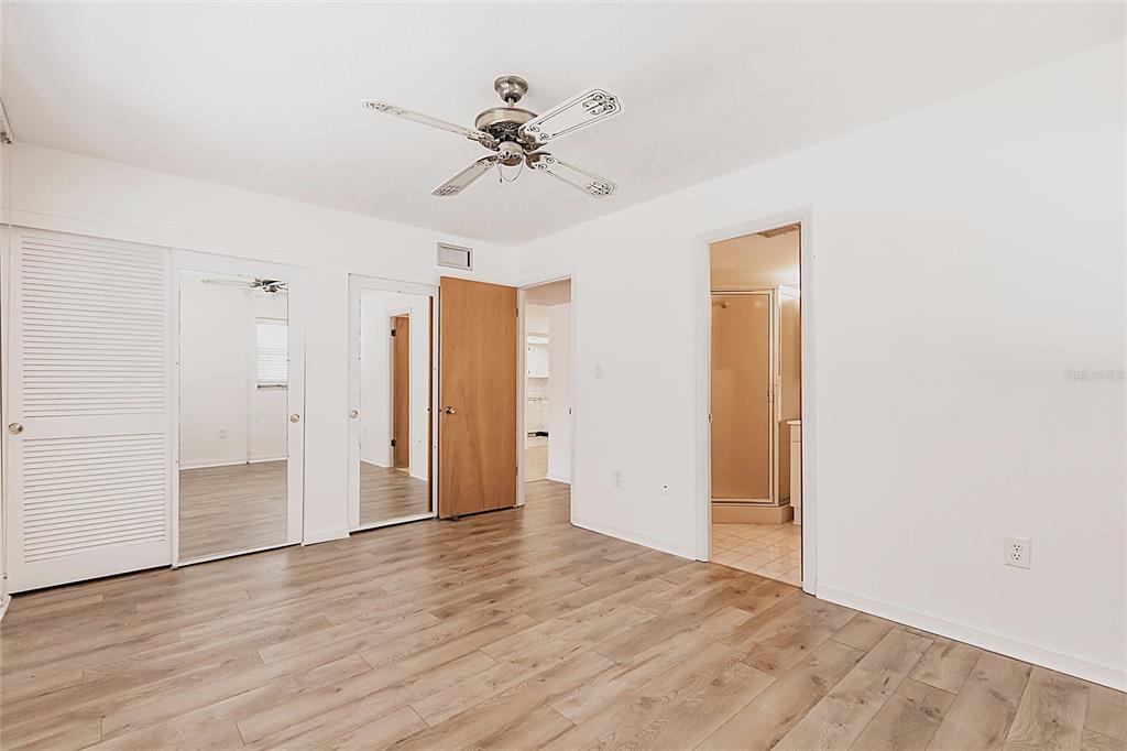 4158 Tamiami Trail, Unit S6 Port Charlotte, FL 33952 - Photo 15 of 39 a view of an empty room and wooden floor